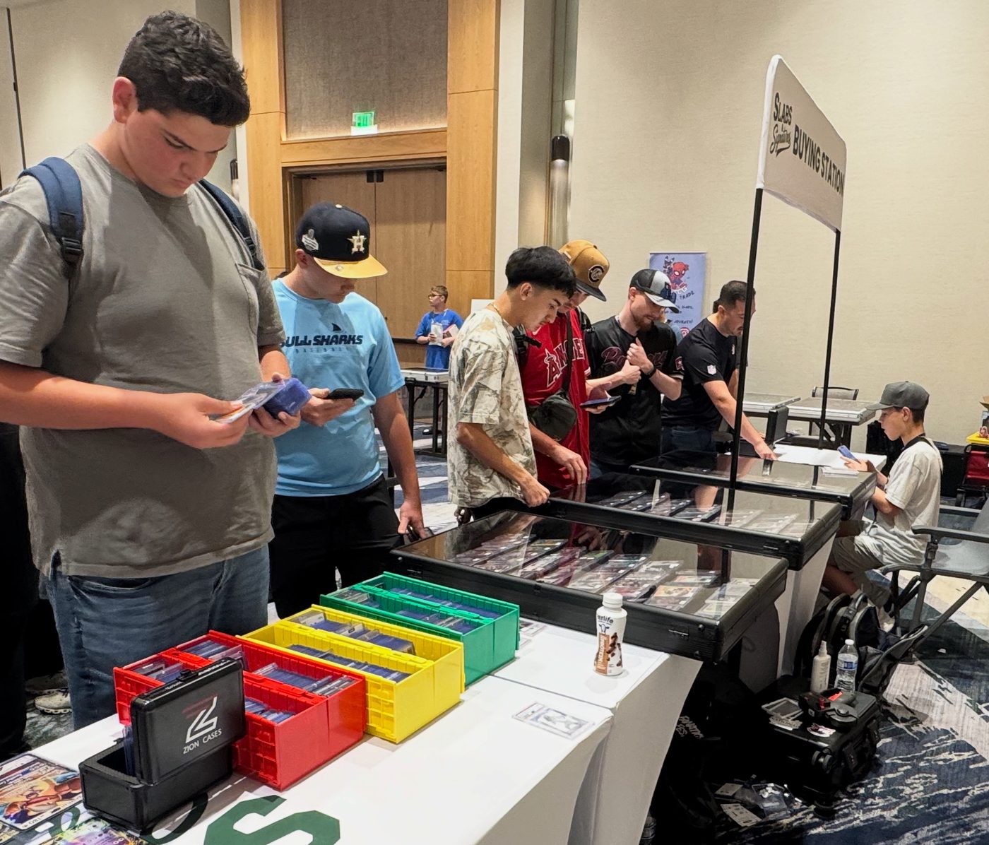 Collectors lined up at the Slabs & Signatures Buying Station and display cases at the Conroe Card Show, September 2025