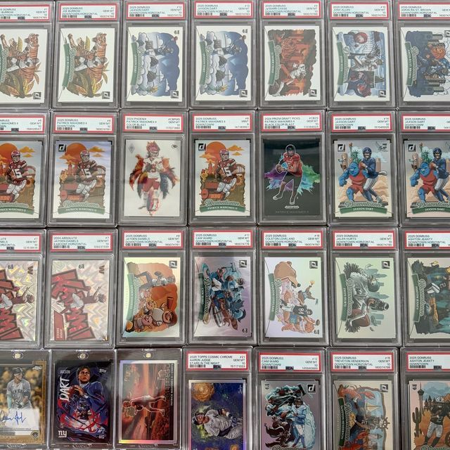 Twenty-eight PSA 10 Downtown and Kaboom slabs laid out in a grid