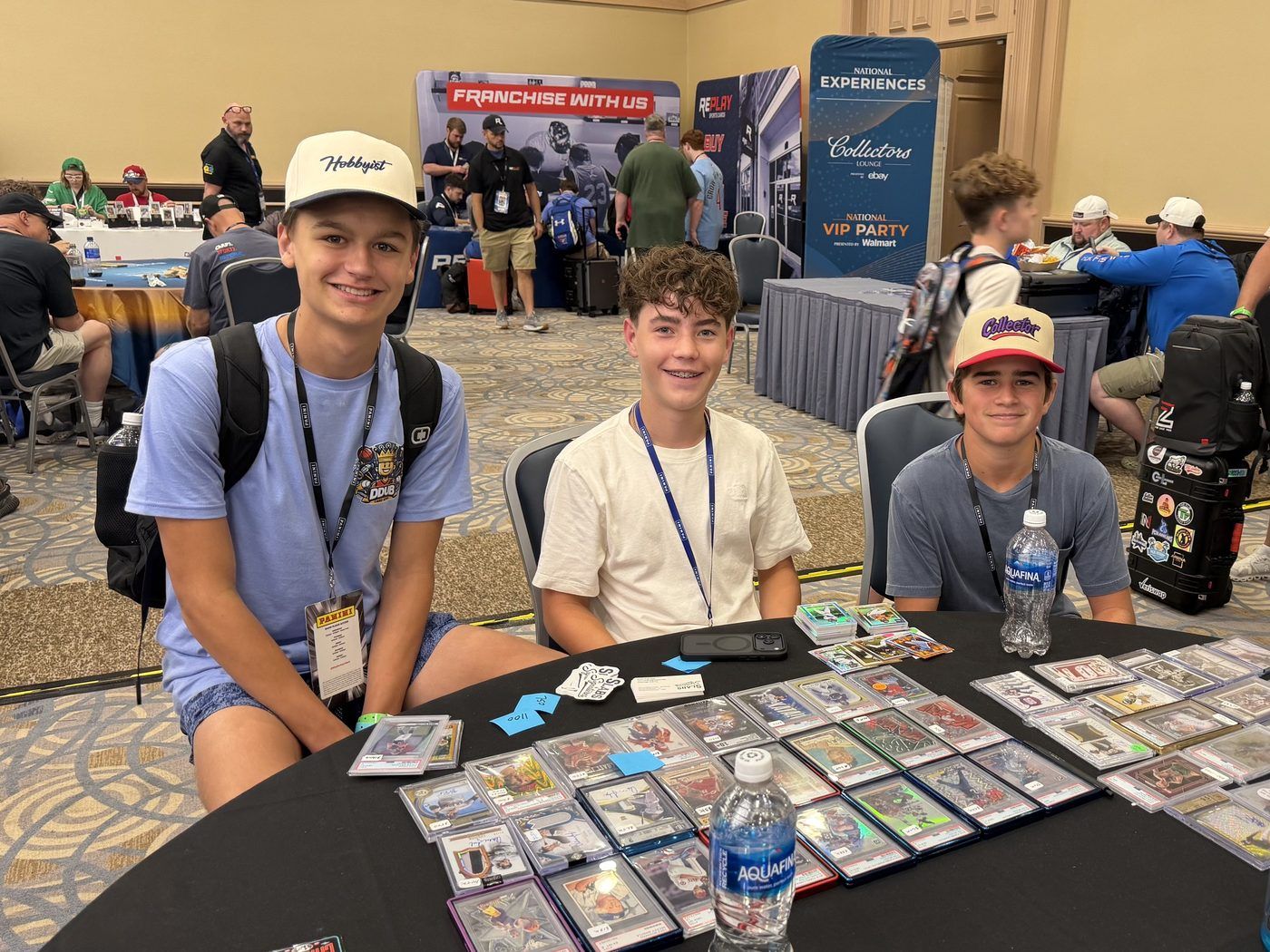Graded cards spread across the Slabs & Signatures table in the Collectors Lounge at the 2026 National Sports Collectors Convention in Rosemont, Illinois