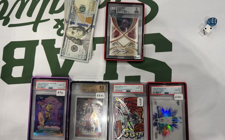 The Michael Jordan SP Game Used Legendary Fabrics autograph patch and cash traded for a Brady Kaboom, LeBron Color Blast, LeBron Topps Chrome rookie and LeBron Downtown at the Dallas Card Show Houston
