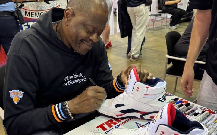 Patrick Ewing signing a pair of his Dream Team model shoes at the 2025 National Sports Collectors Convention in Chicago
